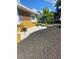 Landscaped front yard with mulch beds and white rock accents at 8272 Le Mesa St, Orlando, FL 32827
