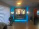 Home theater with large screen TV and electric fireplace at 8272 Le Mesa St, Orlando, FL 32827