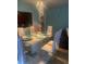 Bright dining area with a white table and modern chandelier at 8272 Le Mesa St, Orlando, FL 32827