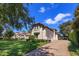 Two-story house with a brick driveway and landscaping at 11227 Macaw Ct, Windermere, FL 34786
