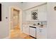 Wet bar with wine rack, beverage fridge, and quartz countertop at 11227 Macaw Ct, Windermere, FL 34786