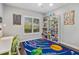 bedroom with a study area and solar system rug at 11227 Macaw Ct, Windermere, FL 34786