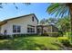 House exterior showcasing a large backyard and pool area at 11227 Macaw Ct, Windermere, FL 34786