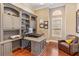 Bright home office features built-in shelving and comfortable seating at 11227 Macaw Ct, Windermere, FL 34786