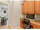 Home office with wood cabinets, granite countertop and computer at 11227 Macaw Ct, Windermere, FL 34786