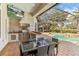 Outdoor kitchen, dining area and view of the pool at 11227 Macaw Ct, Windermere, FL 34786