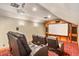 Home theater with comfortable seating and a large projection screen at 11227 Macaw Ct, Windermere, FL 34786