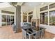 Outdoor patio with seating, dining area, fireplace and a pool at 11227 Macaw Ct, Windermere, FL 34786