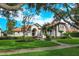 House exterior with manicured lawn and walkway at 11227 Macaw Ct, Windermere, FL 34786