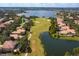 Aerial view showing home location on golf course with lake views at 11227 Macaw Ct, Windermere, FL 34786