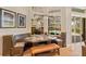 Built-in breakfast nook with seating for four, overlooks pool and patio at 11227 Macaw Ct, Windermere, FL 34786