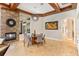 Elegant dining room with stone fireplace and a round dining table at 11227 Macaw Ct, Windermere, FL 34786