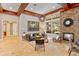 Living room with stone fireplace, comfortable seating, and large windows at 11227 Macaw Ct, Windermere, FL 34786