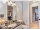 Small bathroom with granite countertop and storage at 11227 Macaw Ct, Windermere, FL 34786