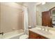 Bathroom with a shower/tub combo and wood vanity at 11227 Macaw Ct, Windermere, FL 34786