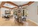 Open floor plan Gathering room with a stone fireplace, large windows, and a separate dining area at 11227 Macaw Ct, Windermere, FL 34786