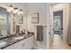Bathroom with a granite countertop, double sink and a view of another room at 11227 Macaw Ct, Windermere, FL 34786