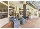 Outdoor patio with seating, fireplace and a pool at 11227 Macaw Ct, Windermere, FL 34786