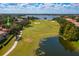 Aerial view of home near golf course and lake at 11227 Macaw Ct, Windermere, FL 34786