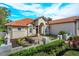 Inviting one-story home with a courtyard and lush landscaping at 11227 Macaw Ct, Windermere, FL 34786