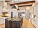 Gourmet kitchen boasts expansive island, high-end appliances, and custom cabinetry at 11227 Macaw Ct, Windermere, FL 34786