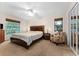 Spacious bedroom with a king-size bed, and plenty of natural light at 530 Estates Pl, Longwood, FL 32779