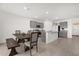 Modern kitchen with gray cabinets, granite countertops, and a kitchen island at 1139 August Sky Dr, Deltona, FL 32738