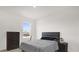 Bedroom with queen bed, dresser and large window at 1139 August Sky Dr, Deltona, FL 32738