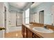 Bathroom with double sinks, tub, and shower at 10759 Gran Paradiso Dr # S, Orlando, FL 32832