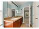 Double vanity bathroom with view of bedroom at 10759 Gran Paradiso Dr # S, Orlando, FL 32832