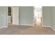 Spacious bedroom with carpet flooring and access to bathroom at 10759 Gran Paradiso Dr # S, Orlando, FL 32832
