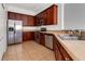 Kitchen with stainless steel appliances and wood cabinets at 10759 Gran Paradiso Dr # S, Orlando, FL 32832