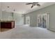 Open concept living room with access to balcony at 10759 Gran Paradiso Dr # S, Orlando, FL 32832