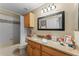 Clean bathroom with granite countertop and a bathtub at 8038 Glitter Ct, Orlando, FL 32836