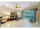 Gathering room features a fireplace, leather seating and access to the pool area at 8038 Glitter Ct, Orlando, FL 32836