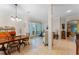 Open floor plan showcasing the dining area and living room with tile floors at 8038 Glitter Ct, Orlando, FL 32836