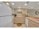 Well-lit kitchen with white appliances and ample counter space at 4831 Saxon Dr # 2270, New Smyrna Beach, FL 32169