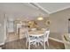 Charming dining area with white table and chairs at 4831 Saxon Dr # 2270, New Smyrna Beach, FL 32169