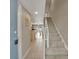 Bright and airy entryway with view into the living area and staircase at 4831 Saxon Dr # 2270, New Smyrna Beach, FL 32169