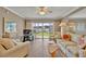 Comfortable living room with beige sofas and a flatscreen TV at 4831 Saxon Dr # 2270, New Smyrna Beach, FL 32169