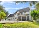 Two-story house with a pool and screened porch at 12200 Treetop Ct, Orlando, FL 32832