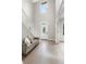 Bright entryway with hardwood floors and staircase at 12200 Treetop Ct, Orlando, FL 32832