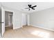 Bright bedroom with wood floors and ceiling fan at 12200 Treetop Ct, Orlando, FL 32832
