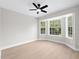 Spacious bedroom with bay window and ceiling fan at 12200 Treetop Ct, Orlando, FL 32832