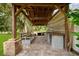 Outdoor pergola with built-in bench and counter at 12200 Treetop Ct, Orlando, FL 32832