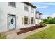 Front entrance with light blue door and walkway at 12200 Treetop Ct, Orlando, FL 32832