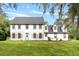 Two story house with shutters and lawn at 12200 Treetop Ct, Orlando, FL 32832