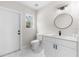 Modern bathroom with white cabinets and marble floors at 12200 Treetop Ct, Orlando, FL 32832