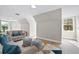 Spacious living room with light walls and comfy seating at 12200 Treetop Ct, Orlando, FL 32832
