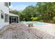 Inviting pool area with brick pavers at 12200 Treetop Ct, Orlando, FL 32832